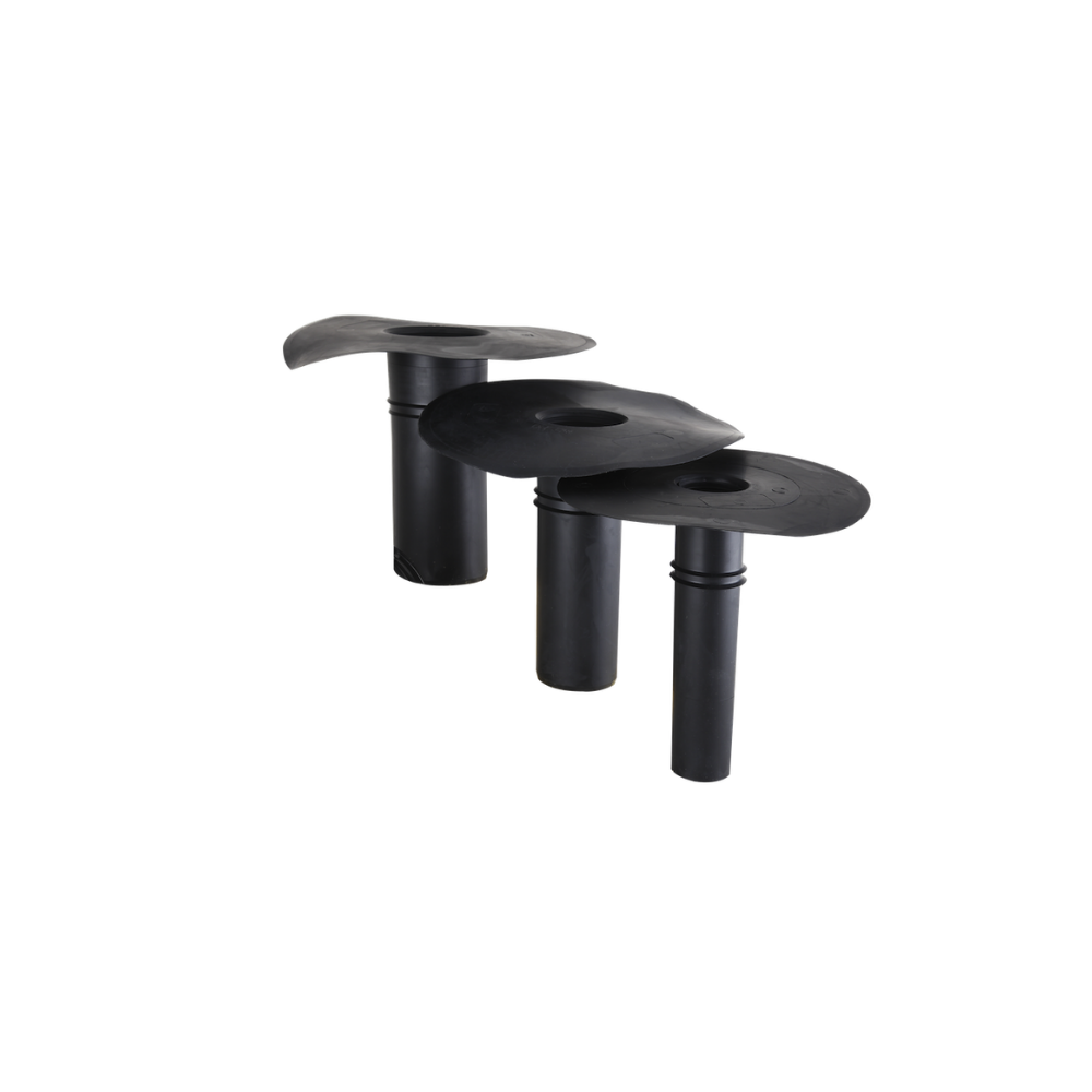 Each outlet (3 shown in this image) consists of a black tube of differing diameter, topped off with a flat squoval area for adhering to the relevant flat surface to create a seal. 